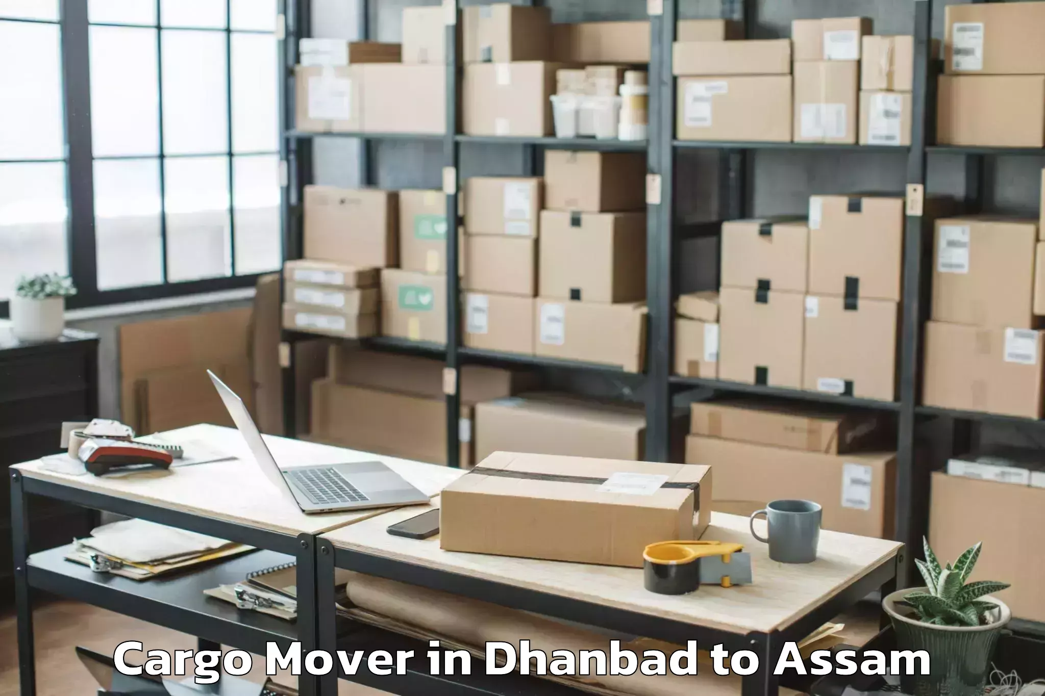 Book Dhanbad to Morigaon Cargo Mover Online